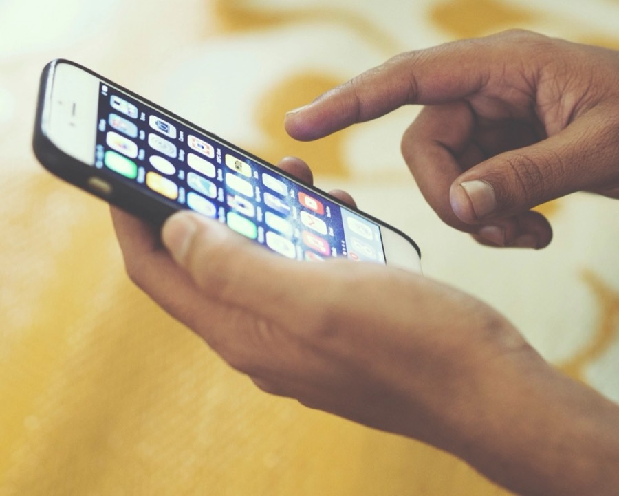 Hand using a smartphone app